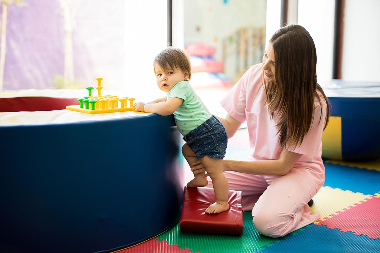 Occupational Therapist working with a toddler